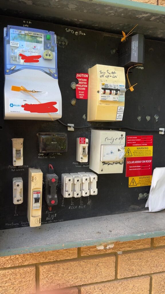 Dangerous outdated domestic ceramic fuse switchboard before electrical upgrade